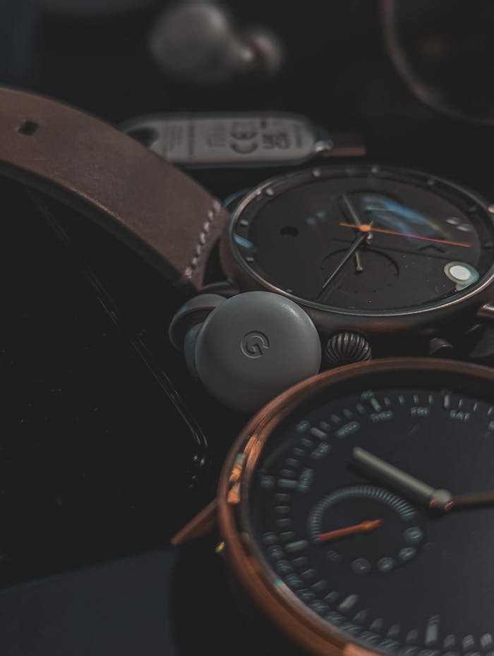 Stylish wristwatches with leather straps displayed on a black surface, exuding luxury and elegance.